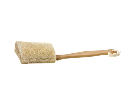 Loofah Sponge with wooden handle isolated in a white backgroundの写真素材