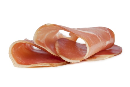 Image of slices of fresh prosciutto against white backgroundの写真素材