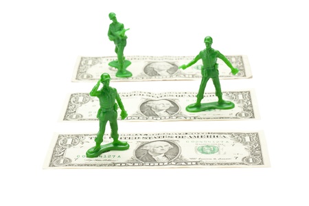 Close up image of toy soldiers with dollars against white backgroundの写真素材
