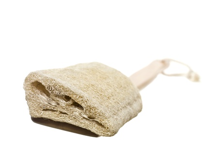 Close up image of wooden loofah brush against white backgroundの写真素材