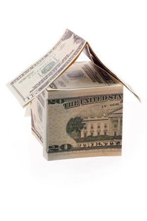 Paper bills folded to build a miniature houseの写真素材