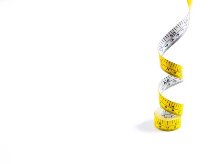 Measuring tape dangled from above.の写真素材