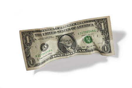 Detailed shot of one US dollar on plain white background.の写真素材
