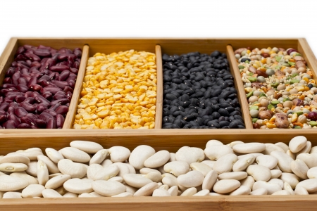 Close-up cropped image of variety of beans in wooden box.の写真素材