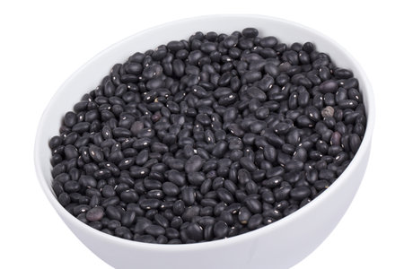Image of black beans in white bowl against white backgroundの写真素材