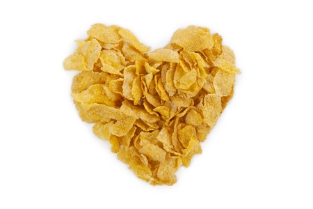 Image of heart shape made of corn flakes against white backgroundの写真素材