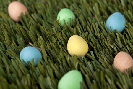 Colorful easter Eggs on the grass on a macro imageの写真素材