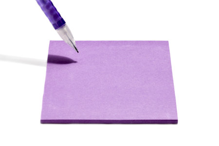 Image of violet pen writing on adhesive paper on a white background