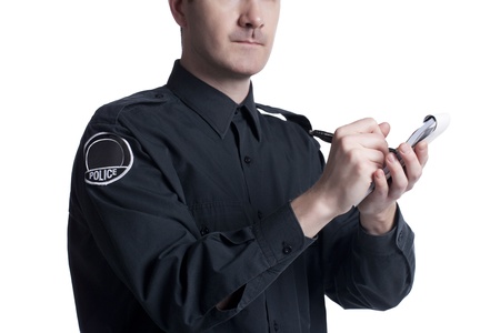Closeup policeman writing penalties on his notepadの写真素材
