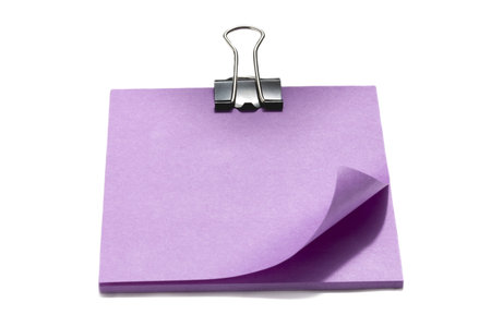 Close up image of violet adhesive note against white background