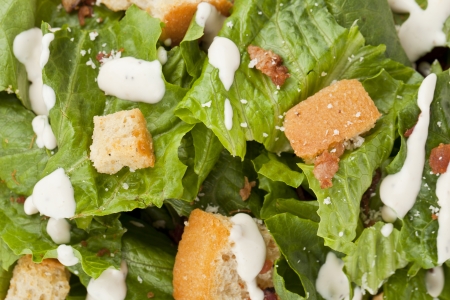 Close-up image of a crispy Caesar salad with crouton toppingsの写真素材