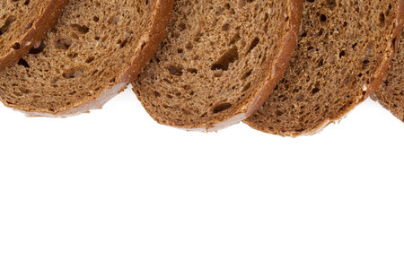 Cropped image of slices of pumpernickel bread on white background
