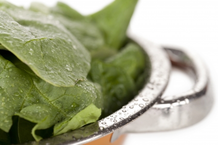 Cropped image of a stainless bowl with shredded fresh green saladの写真素材
