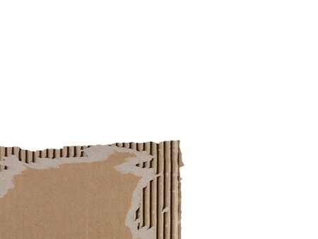 Close-up image of a piece of a brown torn carton on a white backgroundの写真素材