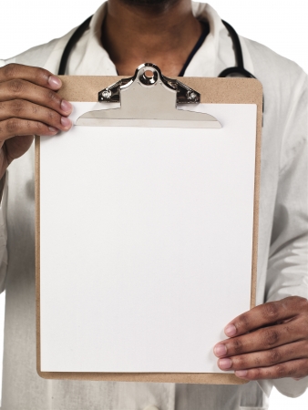 Cropped image of young doctor displaying clipboard, Model: Kareem Duhaneyの写真素材