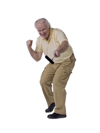 Old male golfer rejoicing his victoryの写真素材