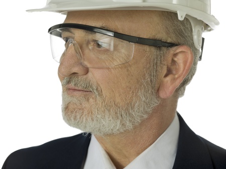 Close up portrait of old architect against white backgroundの写真素材