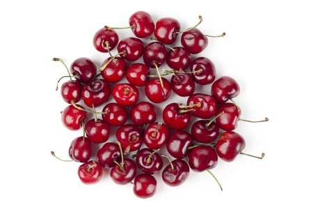 Overhead shot of sweet red cherries against the white backgroundの写真素材