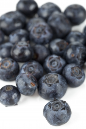 Close up image of pile of blueberries against white backgroundの写真素材