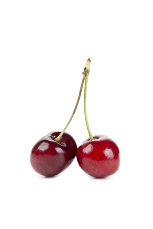 Close up image of two sweet cherries against white backgroundの写真素材
