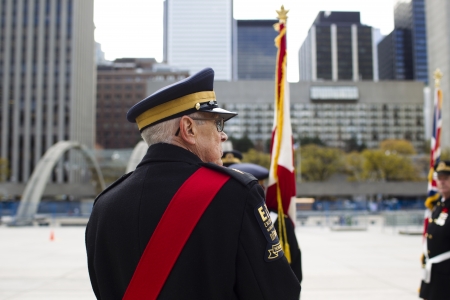Rear view of a senior citizen in military uniform on remembrance day.のeditorial素材