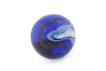 Close-up image of blue glass marble against the white backgroundの写真素材