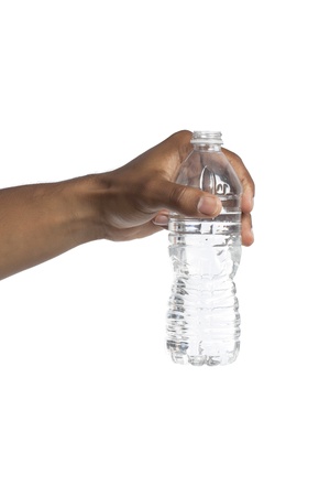 Closeup shot of human hand holding a bottle of water over a white backgroundの写真素材