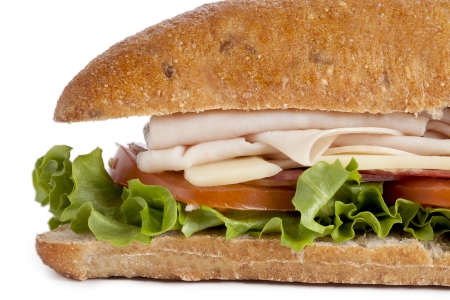 Close-up cropped image of homemade turkey sandwich isolated on a white backgroundの写真素材