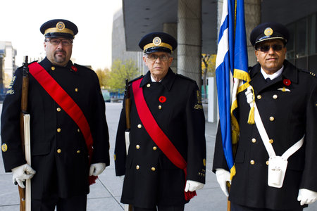 Portrait image of senior man and mature men standing in military uniform on remembrance day.