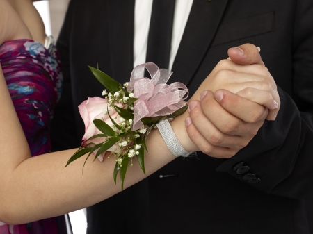 Close up image of pink corsage in a woman wristの写真素材