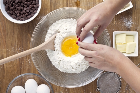 Preparing of baking products on a kitchen wooden tableの写真素材
