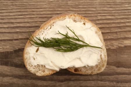 Close up image of bread with butter spread and herbの写真素材