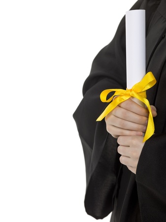 Graduate holding a diploma with yellow ribbonの写真素材