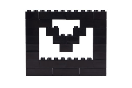 Close up image of envelope maid of lego blocks against white background