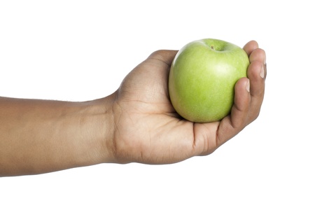 Human hand holding green apple over a white backgroundの写真素材