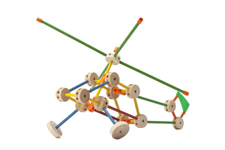 Close up image of helicopter made of tinker toy against white background