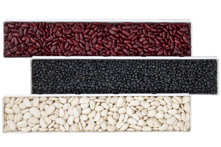 A row of various beans isolated on white