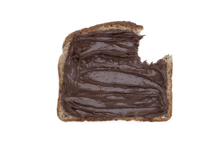 Isolated image of a bitten bread with chocolate spread over a white backgroundの写真素材