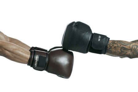 Close-up image of a bumping boxer's fist isolated on a white background