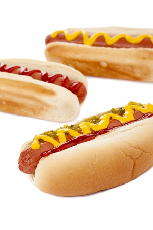 Close up image of three hot dog sandwiches against white backgroundの写真素材