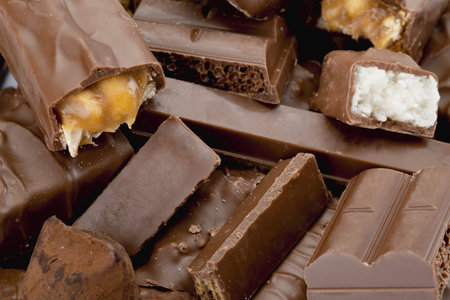 A pile of Dark Chocolate Crispy Rice Wafer Bar in a macro image