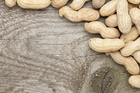 Close up image of dry peanuts on wooden tableの写真素材