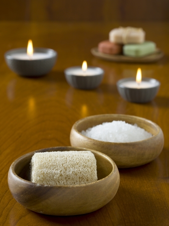 Close up image of herbal spa salt with loofahの写真素材