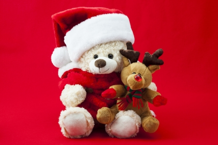 Shot of children's Christmas toys isolated on red.の写真素材