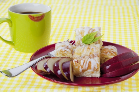Close-up of apple pie served with a mug of black coffee.の写真素材
