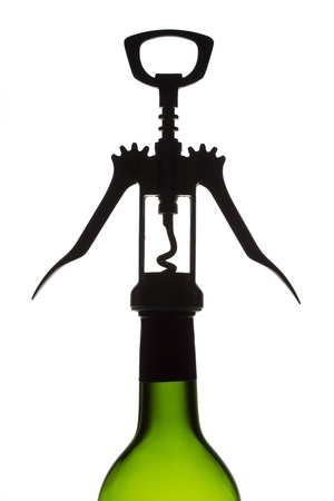 Corkscrew with wine bottle isolated on white backgroundの写真素材