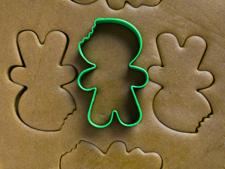 Green cookie cutter in the top of dough