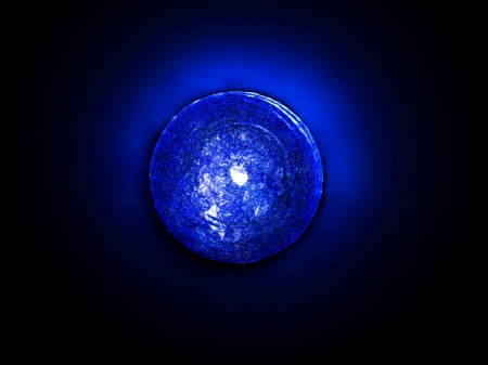Image of a blue light on the dark backgroundの写真素材