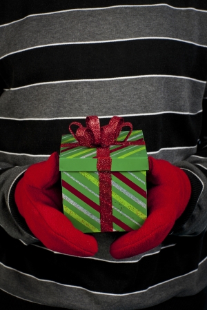 Cropped close-up view of a man holding christmas giftの写真素材