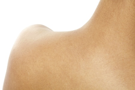 Macro image of a human skin with the camera focused on her nape and shoulderの写真素材